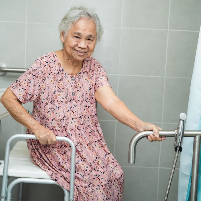 Asian senior lady preparing for bath