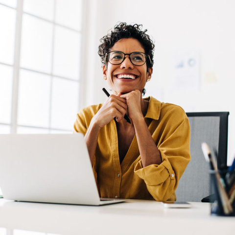 happy woman at desk