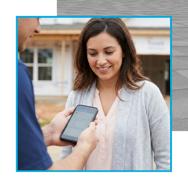 Roofing Contractor talking to homeowner