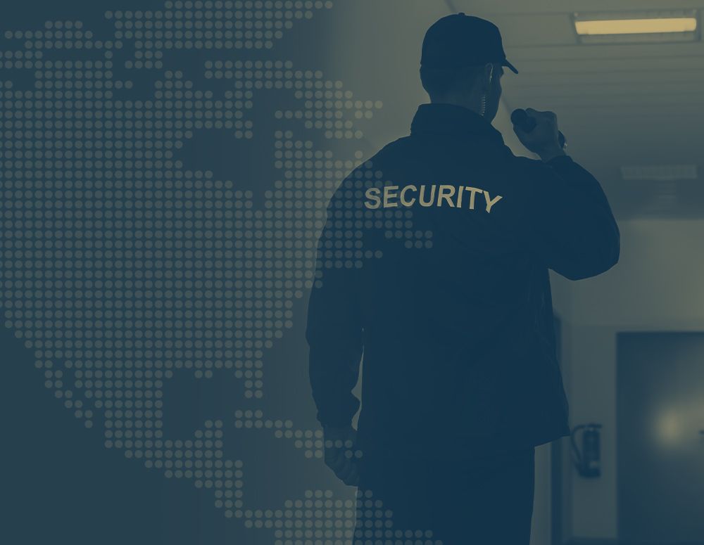 a security person looking in a dark hallway a security person looking in a dark hallway