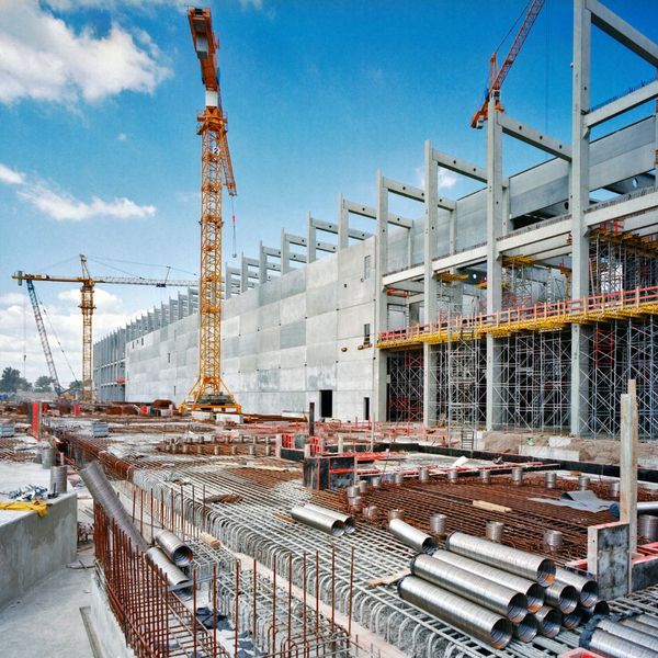 a large construction site with multiple cranes