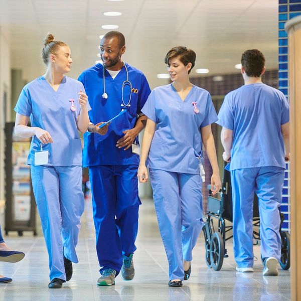 nurses walking through a hospital