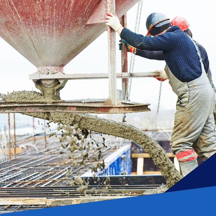 workers pouring concrete