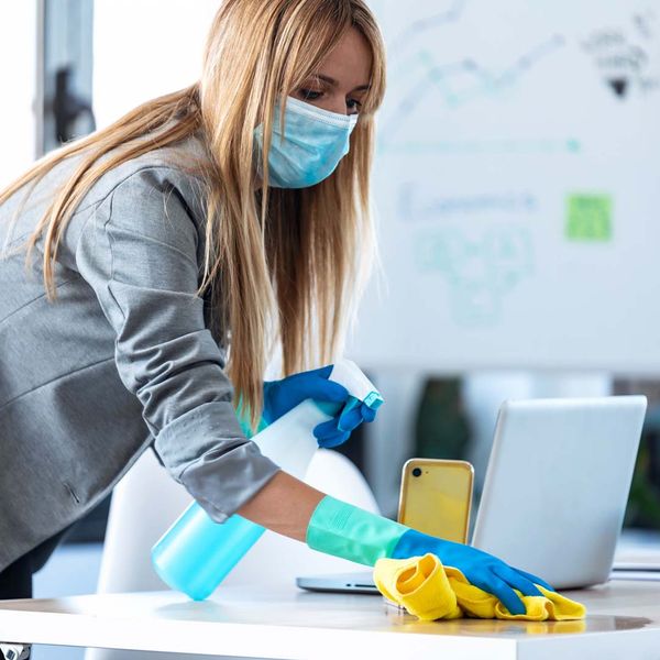 Woman cleaning a desk