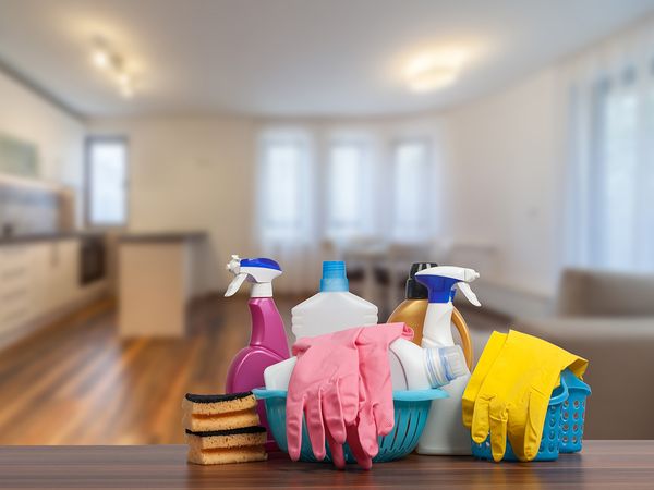  Image of assorted cleaning supplies on the countertop of a home.