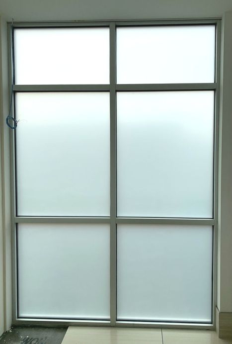 Installation of frosted window film.