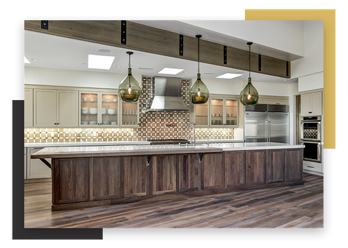long kitchen island with 3 pendant lights hanging above it