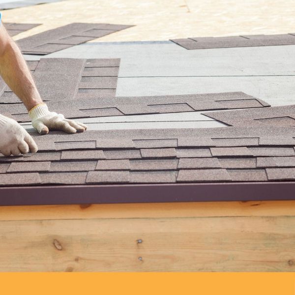 roofer replacing shingles