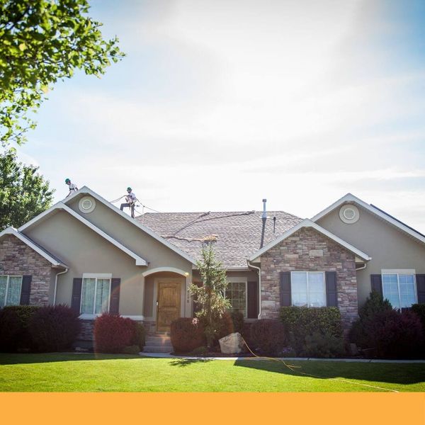 roofers on top of a roof