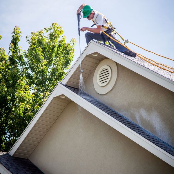 roofer cleaning point of roof roofer cleaning point of roof