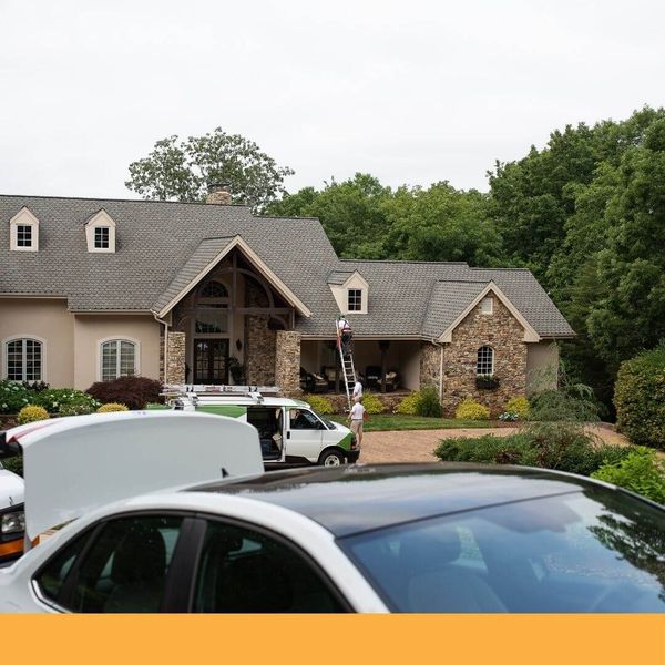 roofers climbing a ladder