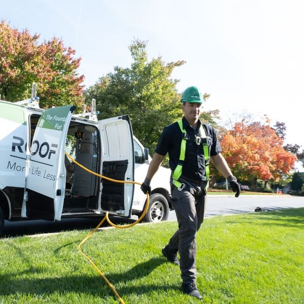 Guaranteed Roof employee getting ready to apply our roof restoration product