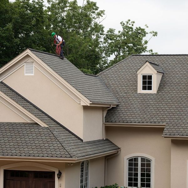 roofer inspecting a roof