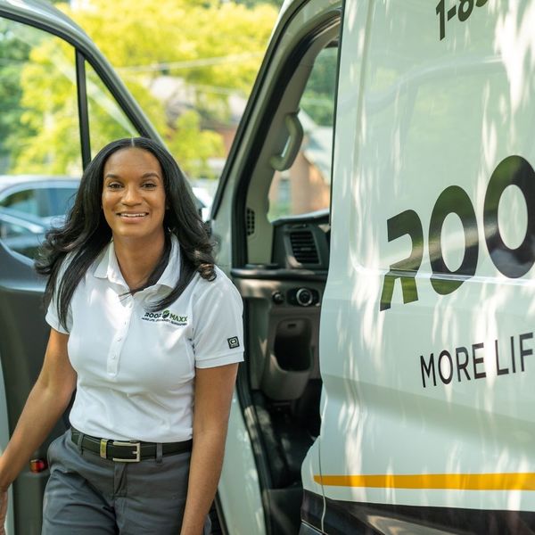 Guaranteed Roofing employee getting out of van