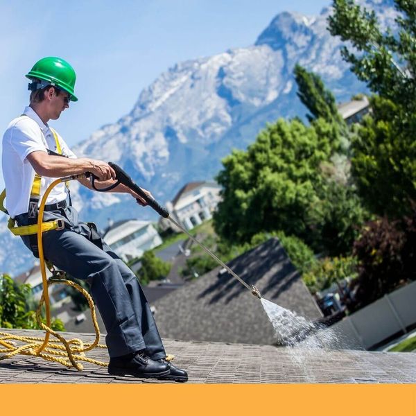 roofer conducting roof cleaning services