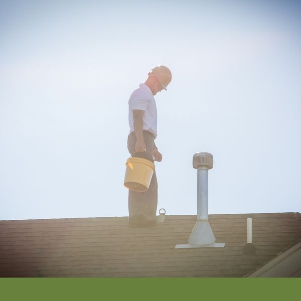 roofer standing on a roof