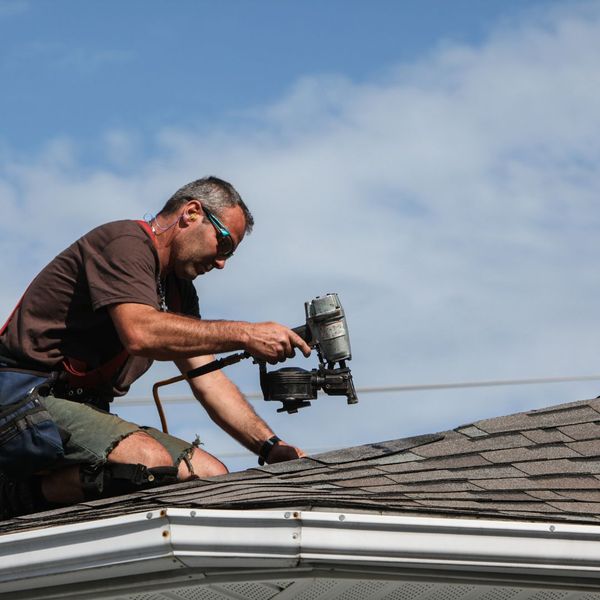 roofer installing roof