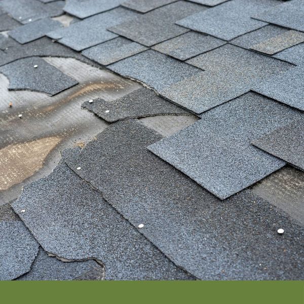 damaged shingles after a storm