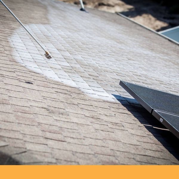 roof being cleaned by Guaranteed Roof