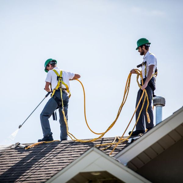 two roofer cleaning roof of home two roofer cleaning roof of home