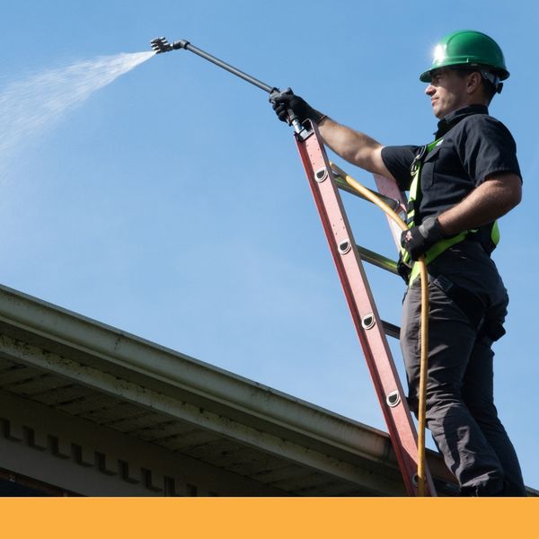 Man washing roof