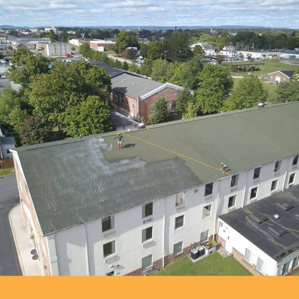 roof being cleaned with roof shampoo