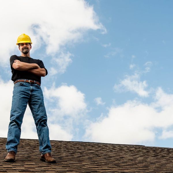 man standing on roof