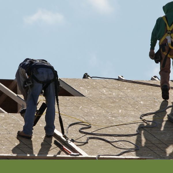 Men installing a new roof