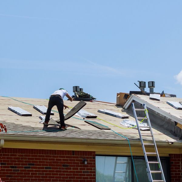 People installing new roof