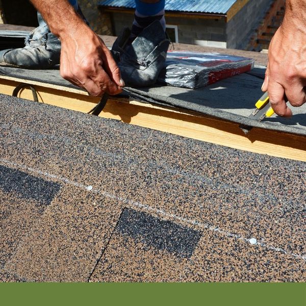 contractor repairing a roof after a storm