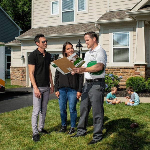 Roof tech speaking with clients Roof tech speaking with clients