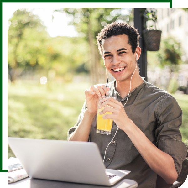 Happy guy working on computer
