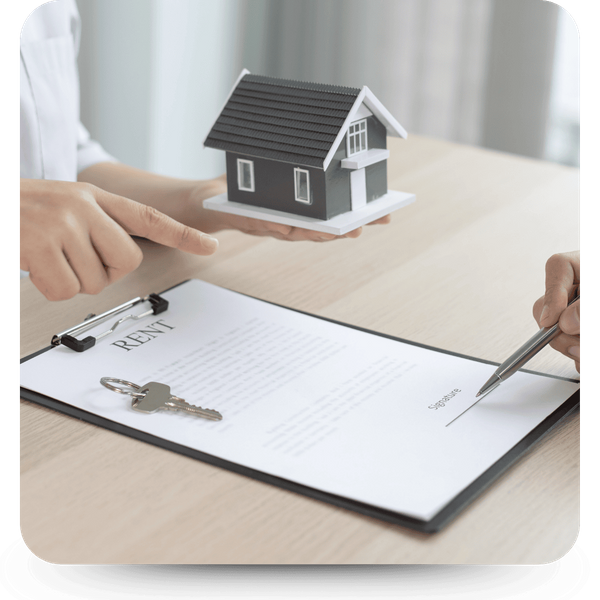 Image of a person signing a lease