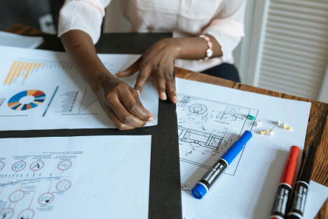Image of a person with floor plans