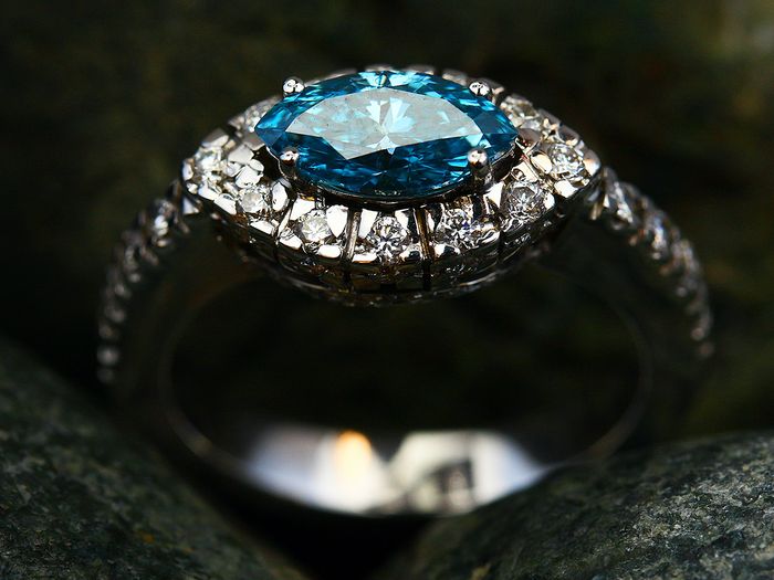 Blue sapphire ring with diamond halo