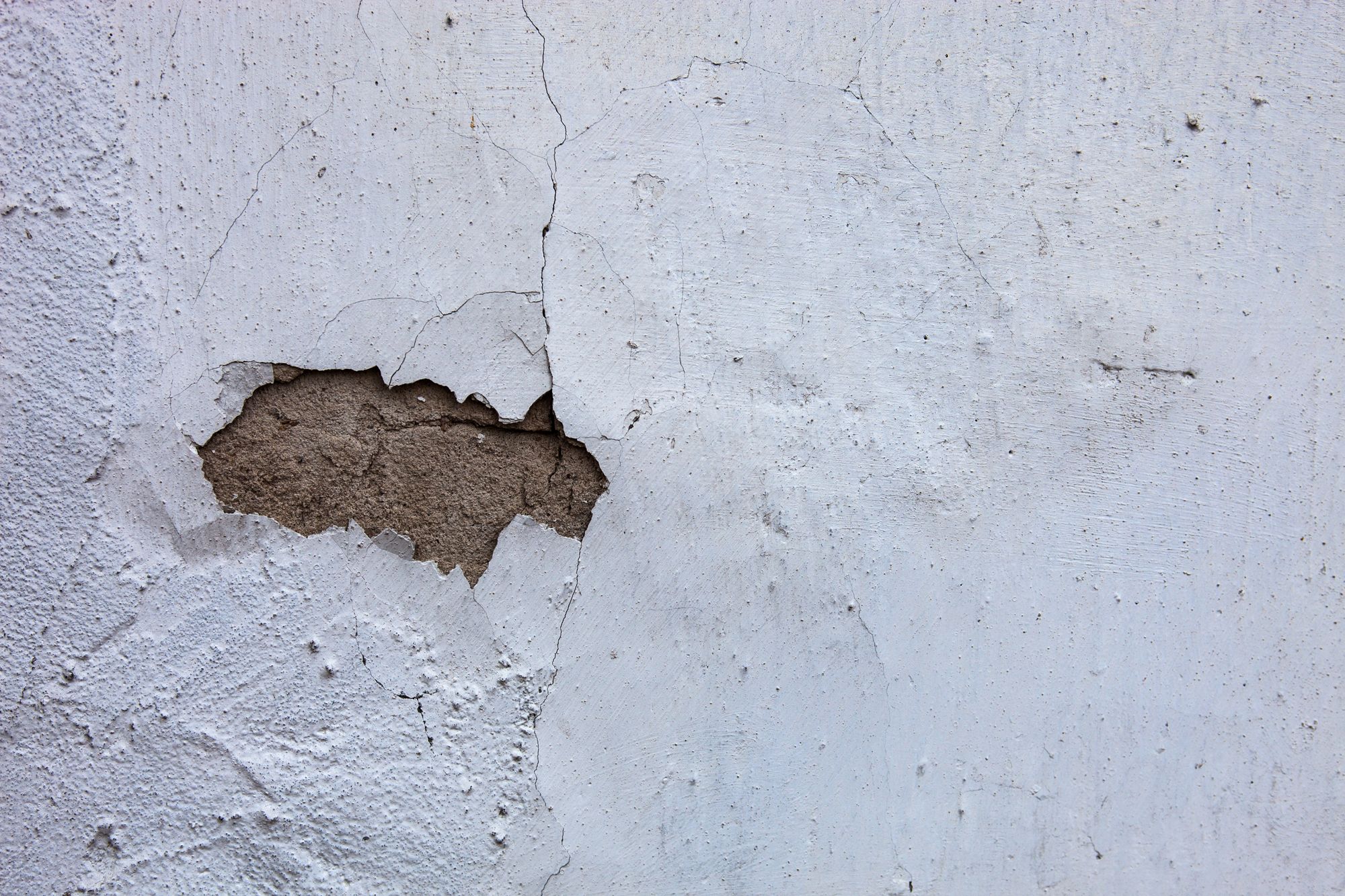 hole in stucco wall