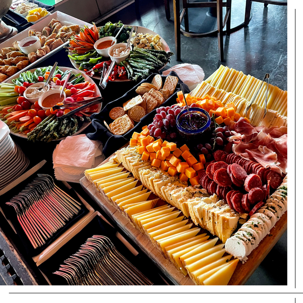 catering trays, charcuterie and raw vegetables