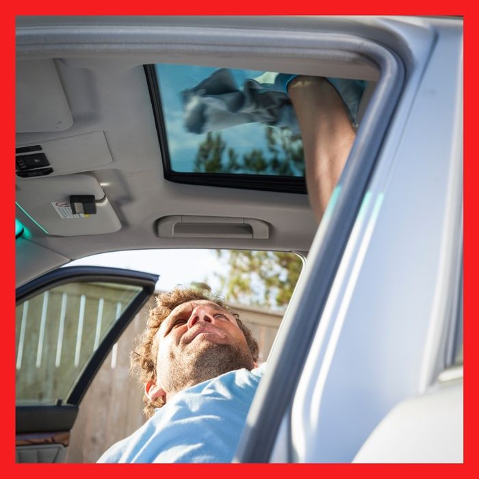 image of a man cleaning a sun roof