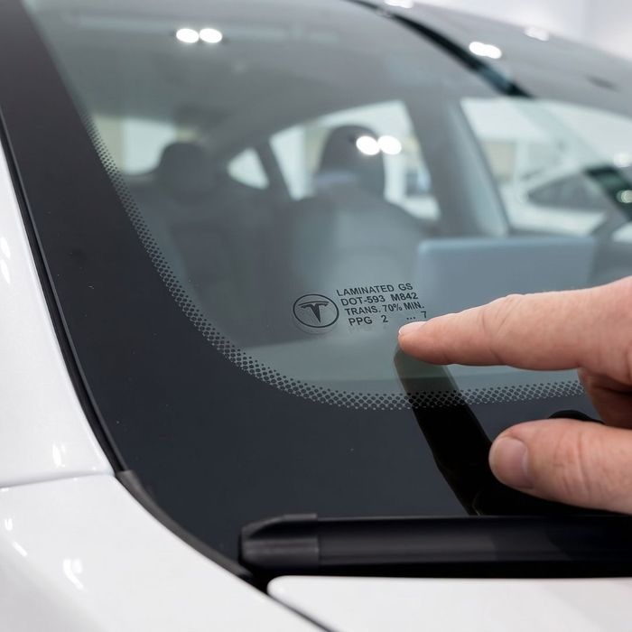 details in bottom corner of windshield