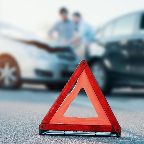 Hazard sign in front of car crash