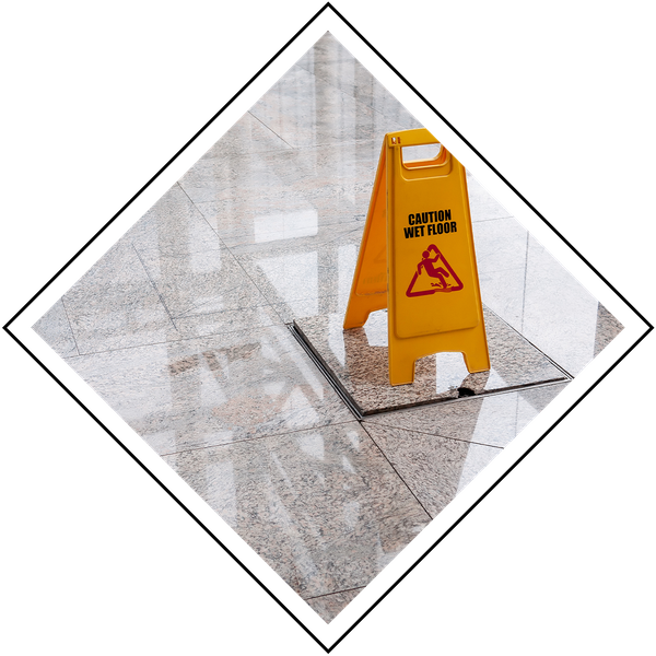shiny clean floor with caution wet floor sign