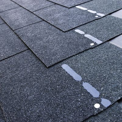 installing new roofing shingles