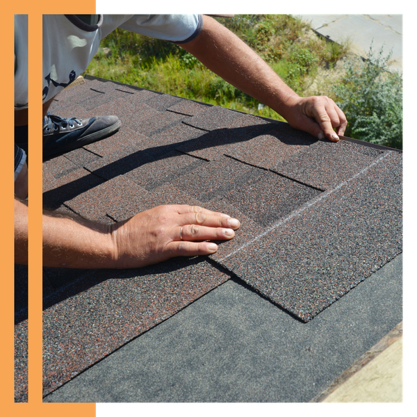 roofing contractor repairing shingles