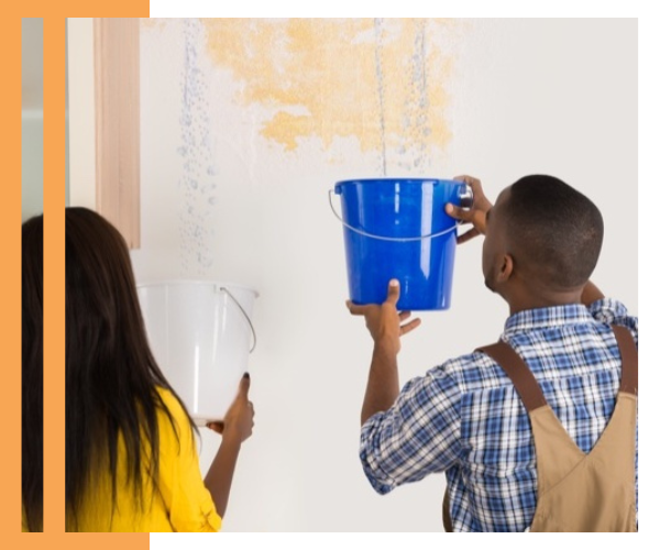 people holding buckets that are catching water coming from roof