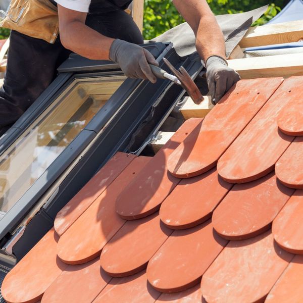 Contractor Repairing a Damaged Tile Roof What Are the Best Maintenance Tips to Extend the Life of a Tile Roof3.jpg