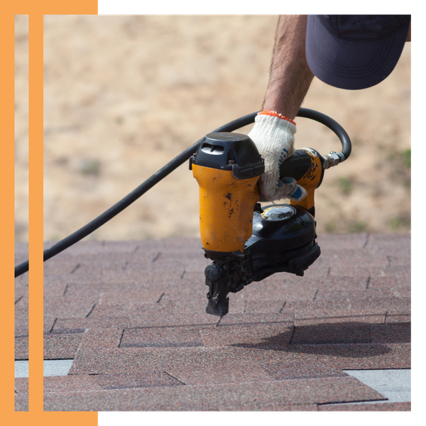 roofing contractor using a nail gun
