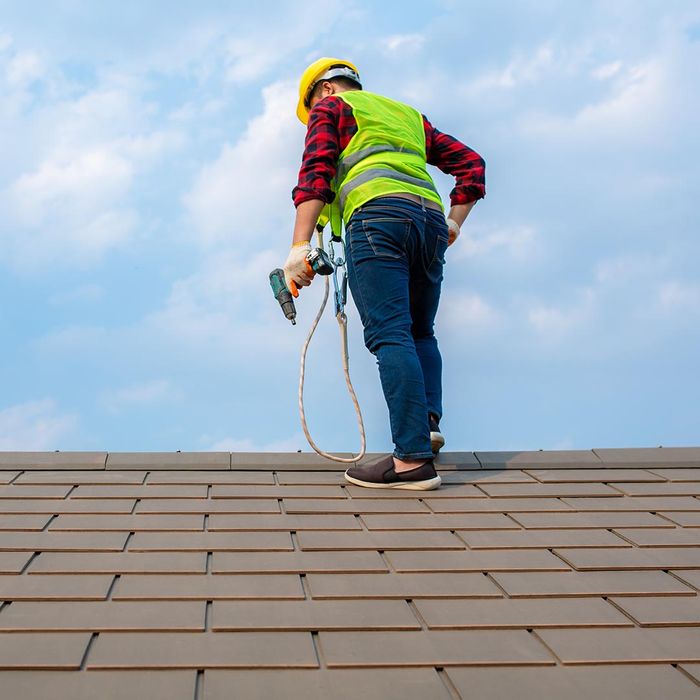 roofer repairing a roof
