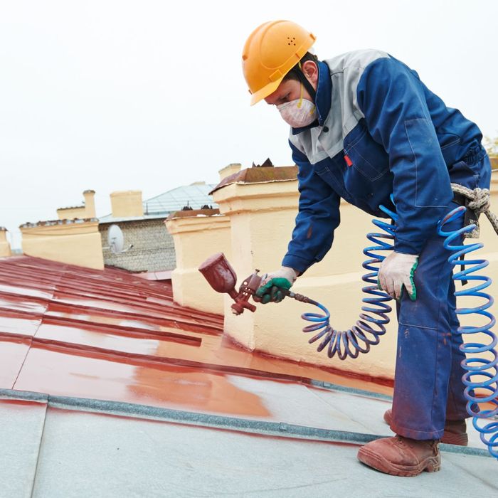 applying protective coating to commercial roof