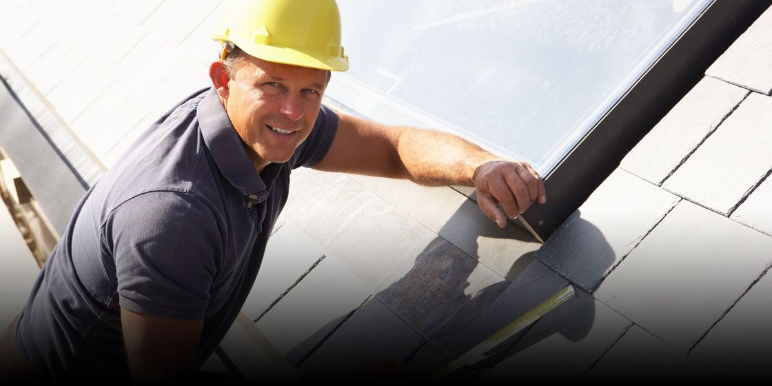 Roofer doing measurements