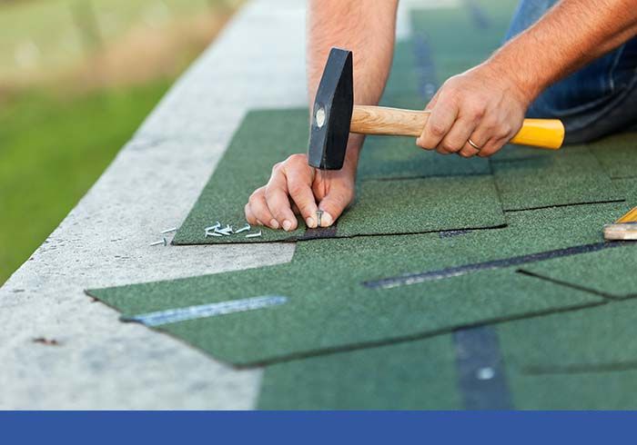 nailing down green shingles